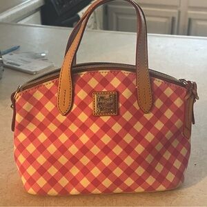 Bright pink and white Dooney Bourke, small purse.